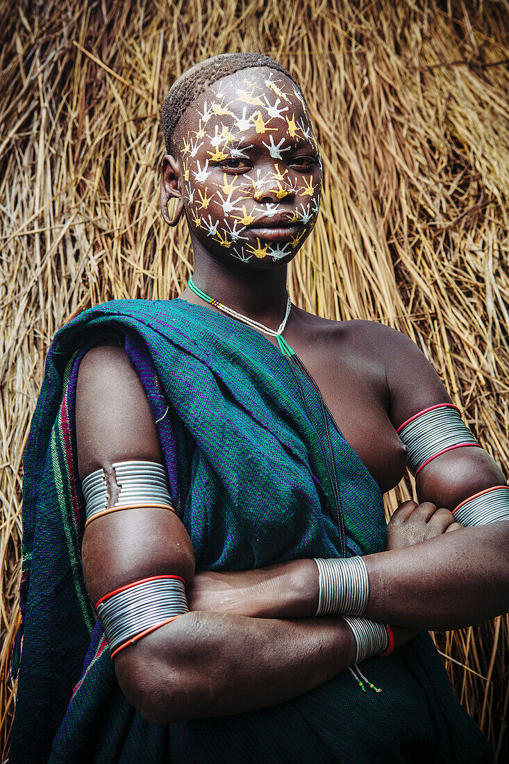 'Young Surma (Suri) woman with traditional face decoration, Southwest Ethiopia; Kibish, Ethiopia'