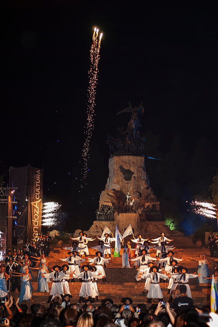'Argentine folklore dance in front of monument; Mendoza, Argentina'