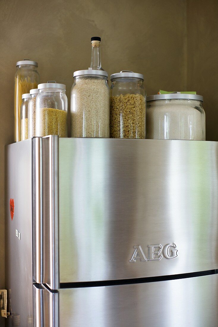 Storage jars on an stainless steel fridge