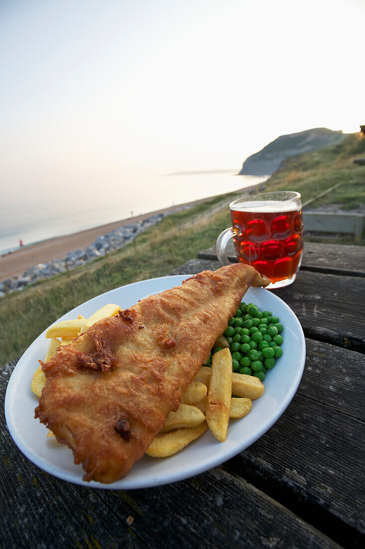 'Fish and chips in a pub on the Dorset coast in a sea town; Dorset, England'