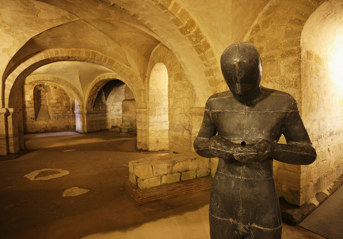 'Statue by Antony Gormley in the Norman Crypt of Winchester Cathedral; Winchester, Hampshire, England'