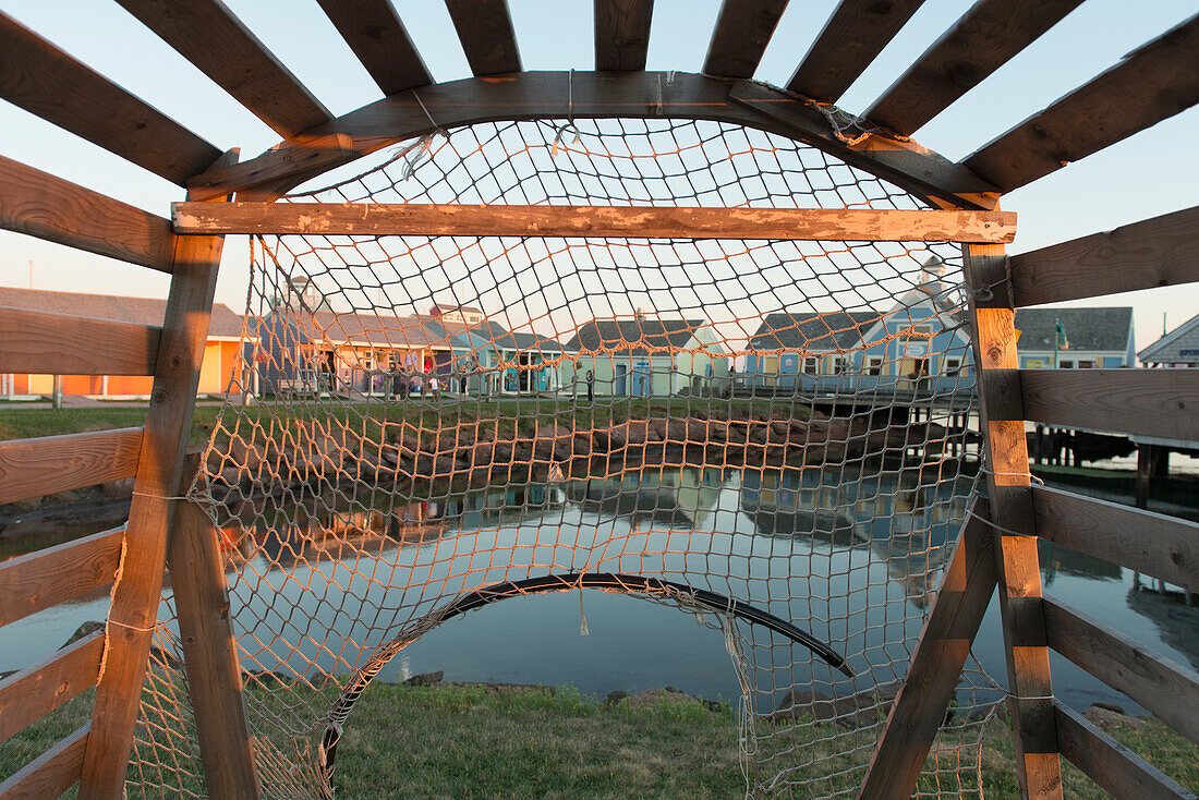 'View of Spinnakers Landing through a lobster trap; Summerside, Prince Edward Island, Canada'