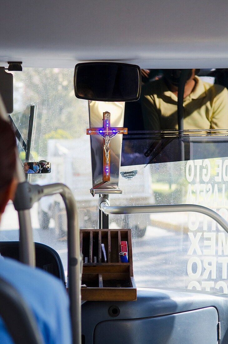'Transit bus in Mexico with Christian crucifix in the front window; Guanajuato, Mexico'
