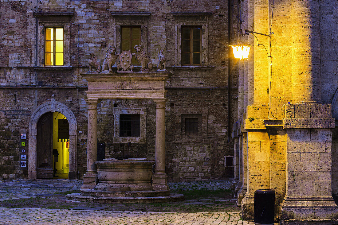 'Golden light illuminates walls on old renaissance buildings; Montepulciano, Tuscany, Italy'