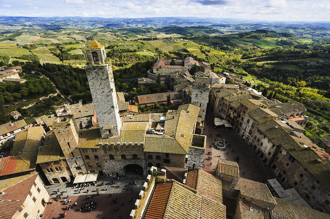 'Stone tower and rooftops; San Gimignano, Tuscany, Italy'