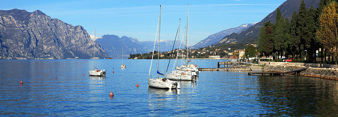'Boats moored in a harbour of Lake Garda; Malcesine, Verona, Italy'