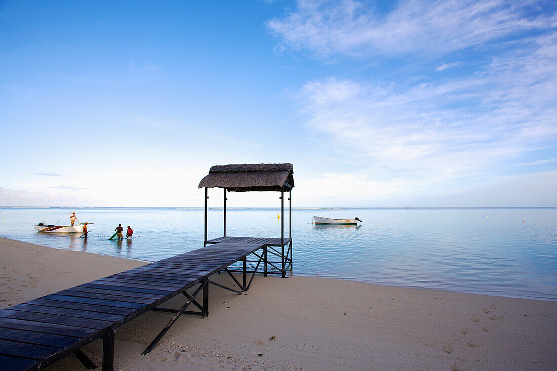 'A boardwalk leading over the sand to the ocean; Mauritius'