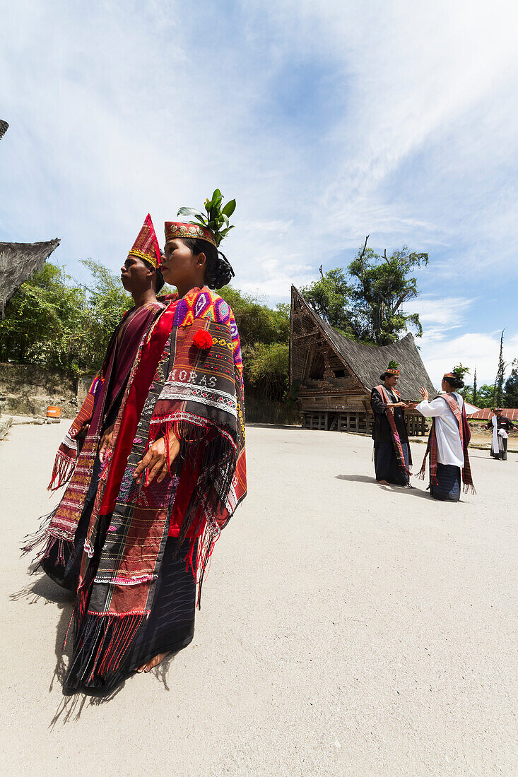 Toba Batak people performing a traditional Batak dance at Huta Bolon Museum in Simanindo village on Samosir Island, Lake Toba, North Sumatra, Indonesia