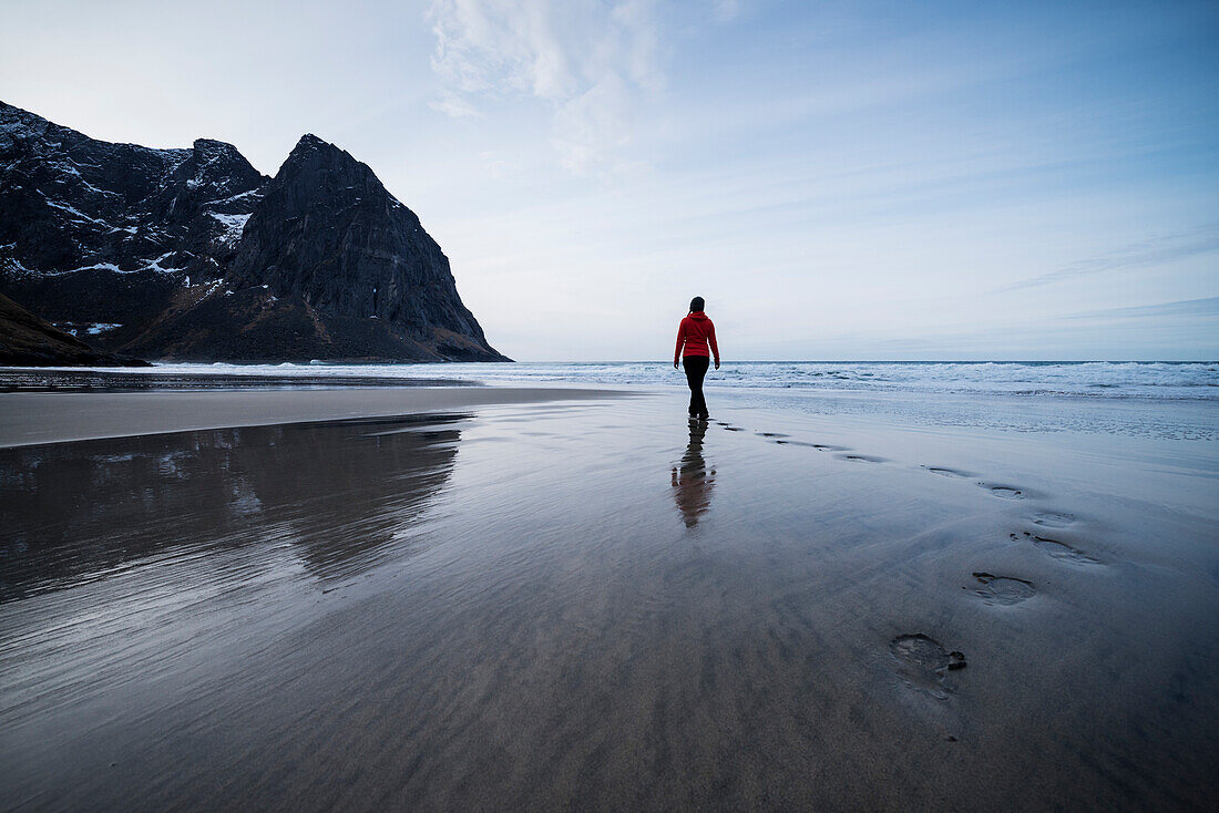 Person leaves footpints in sand at scenic Kvalvika beach, Moskenes??y, Lofoten Islands, Norway
