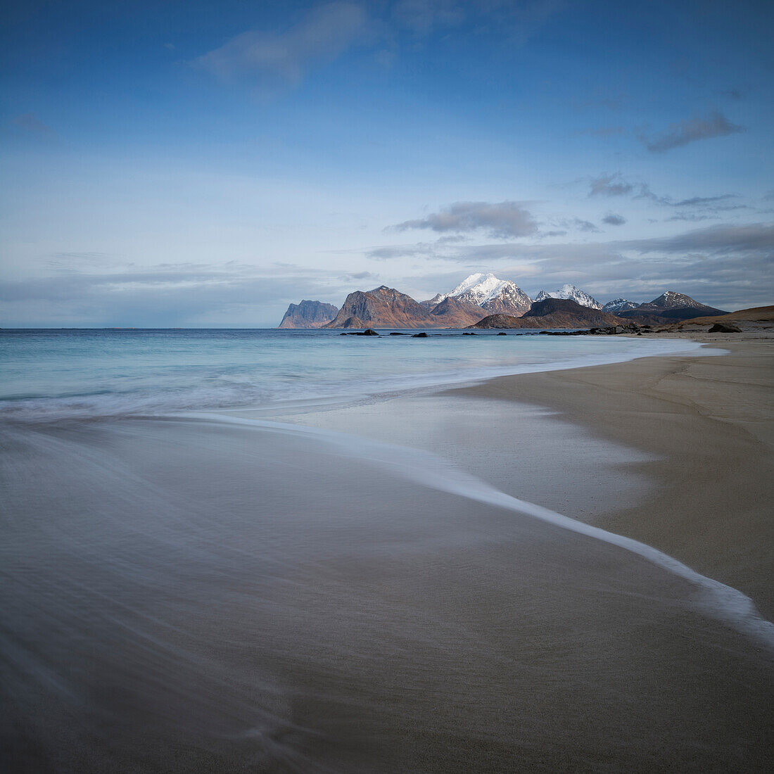 Waves wash over soft sands at Storsandnes beach, Flakstad??y, Lofoten Islands, Norway