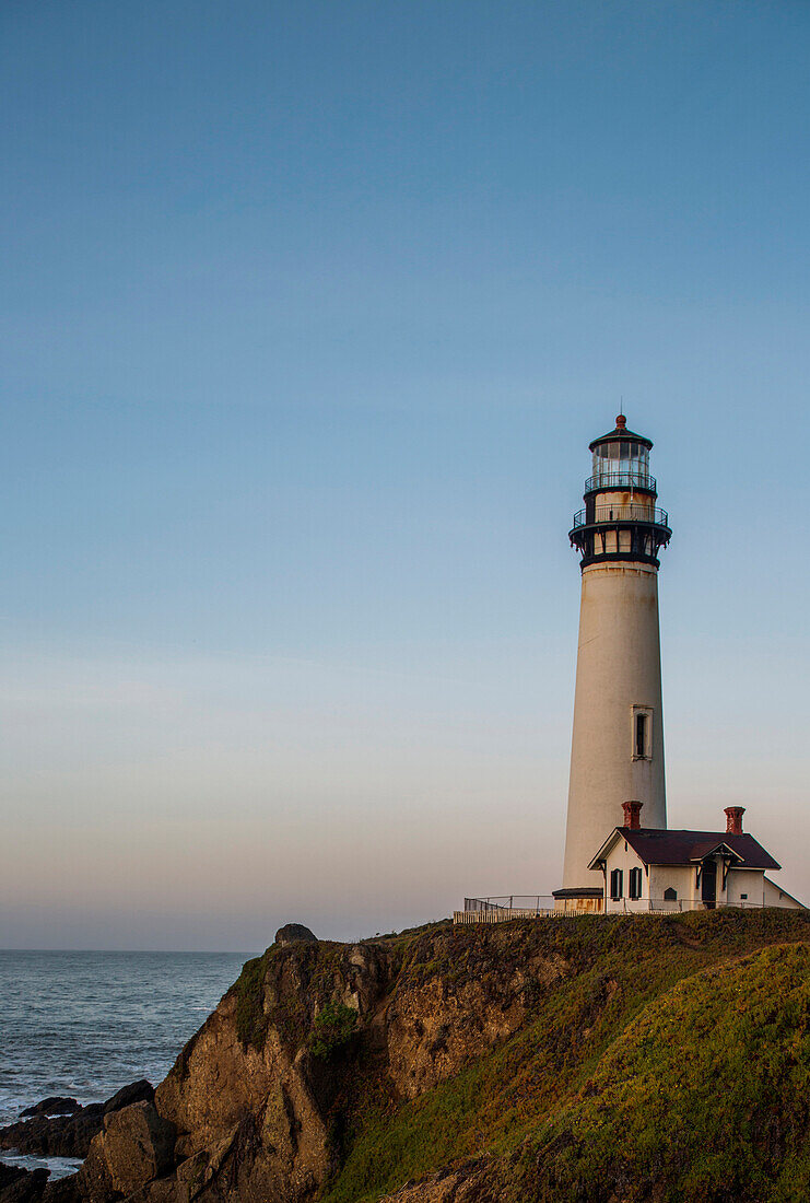 The Pigeon Point Lighthouse near Pescadero, California on a sunny day.