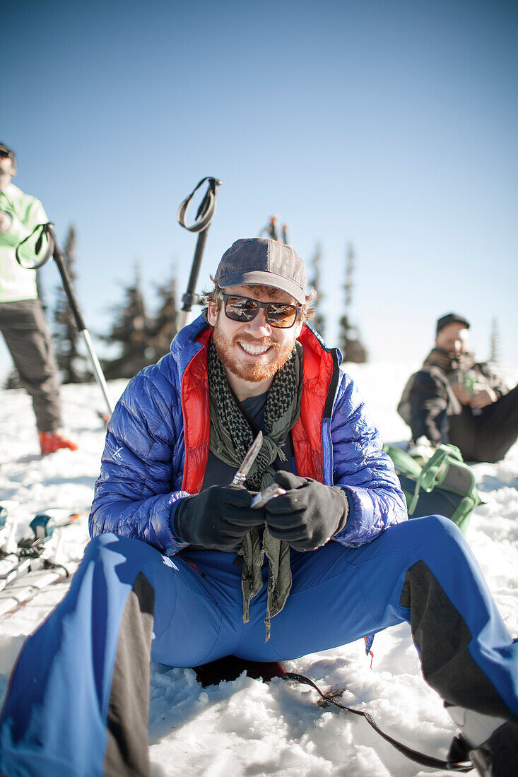 A backcountry skier stops for lunch.