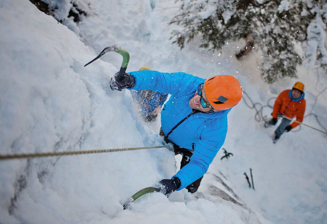 A man climbs a wall of ice in Whistler, British Columbia, Canada.