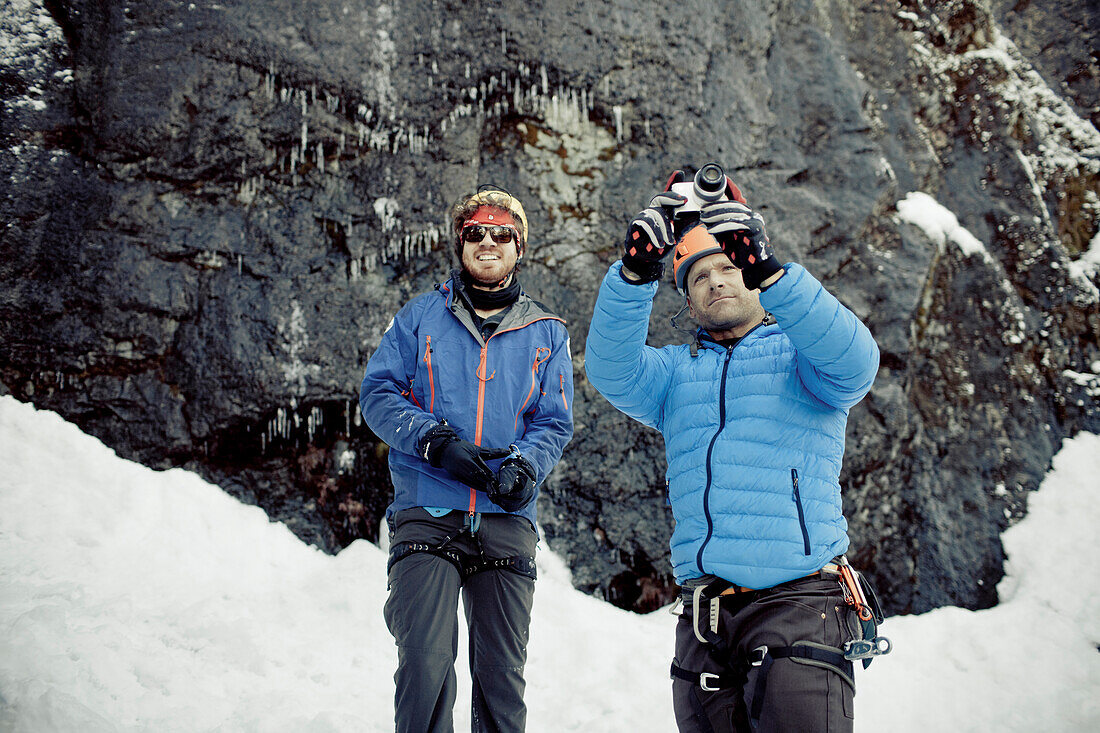 A climber takes a picture of the scenery in Whistler, British Columbia, Canada.