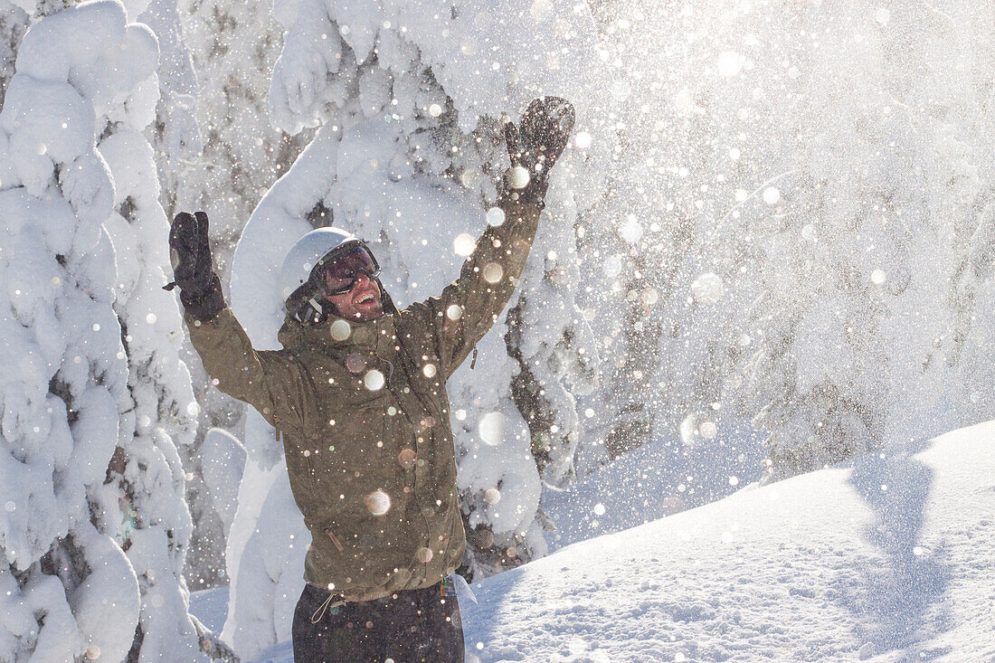 A male snowboarder smiles in Whitefish, Montana.