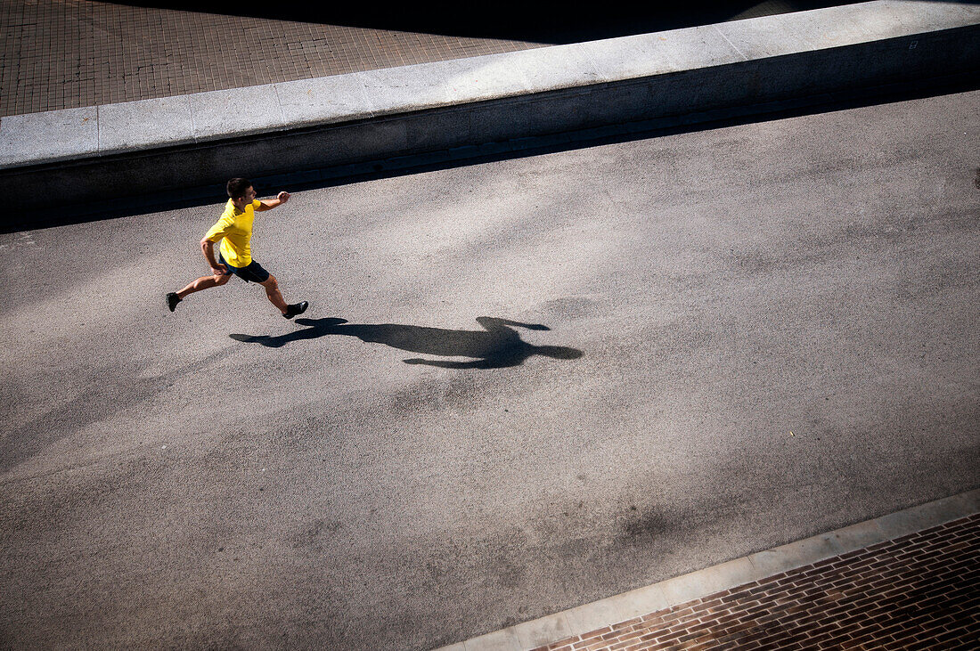 Male running on path in Barcelona, Spain.