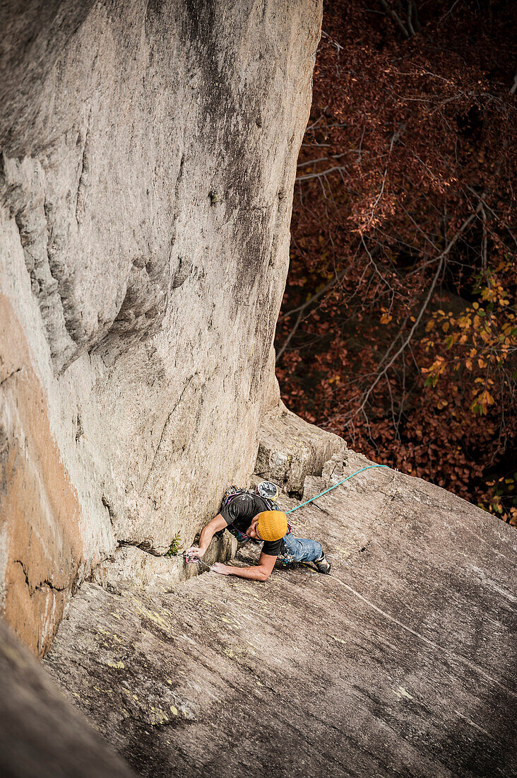 Man lead climbing a two pitches crack route in trad style, where only friends and nuts are allowed to protect the progression. Cadarese is a granite crag located in Premia, Ossola Valley, and is growing to one of the best european destination for trad and