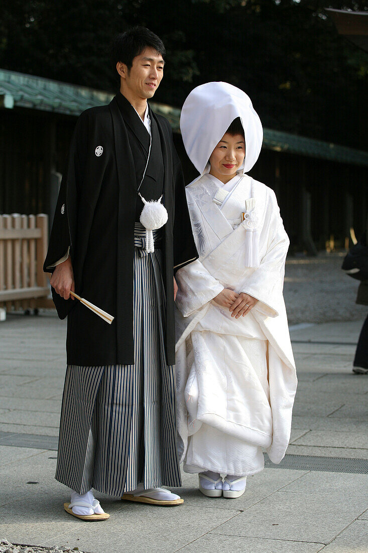 'After The Traditional Japanese Shinto Wedding Ceremony Families Gather For A Formal Portrait Sitting, At Meiji Jingu Shrine; Near Harajuku Station; Tokyo. Here The Bride And Groom Pose For A More Informal Shot After The Formal Photo Sitting.There Are Sev