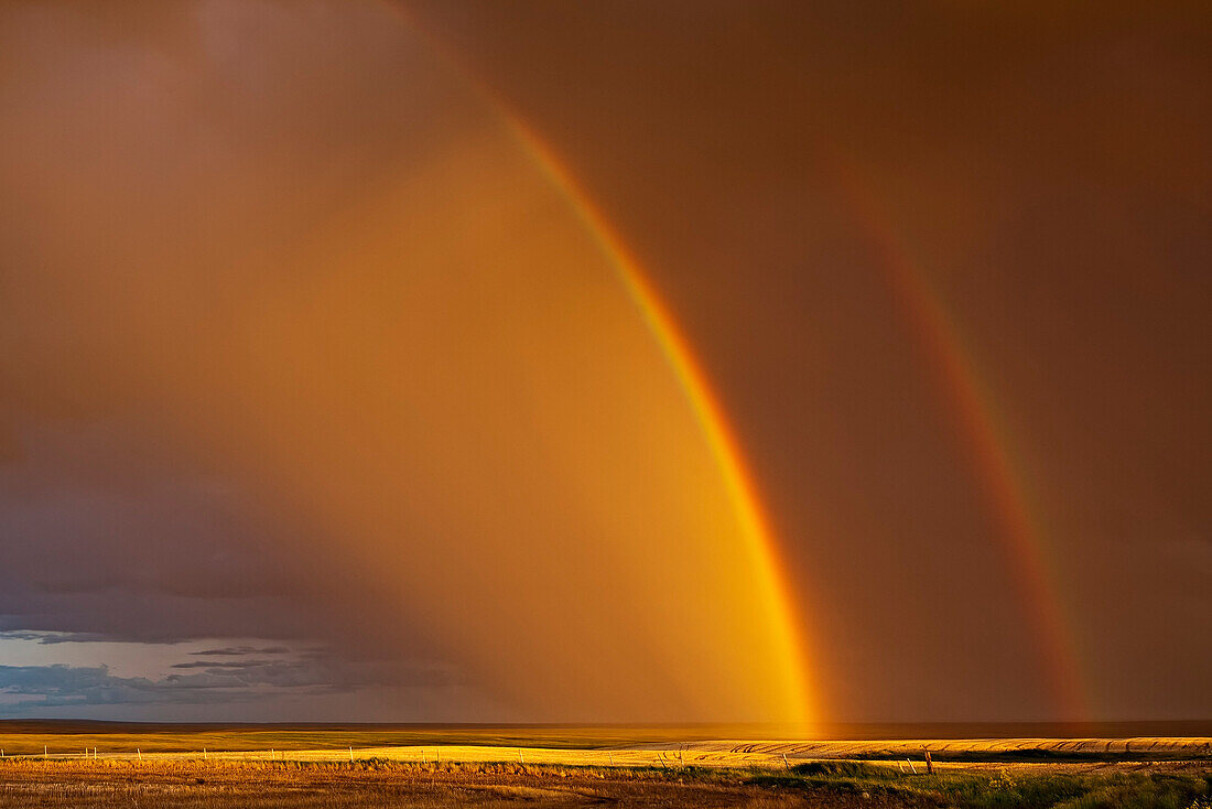 'Double rainbow over a prairie field after a storm; Val Marie, Saskatchewan, Canada'