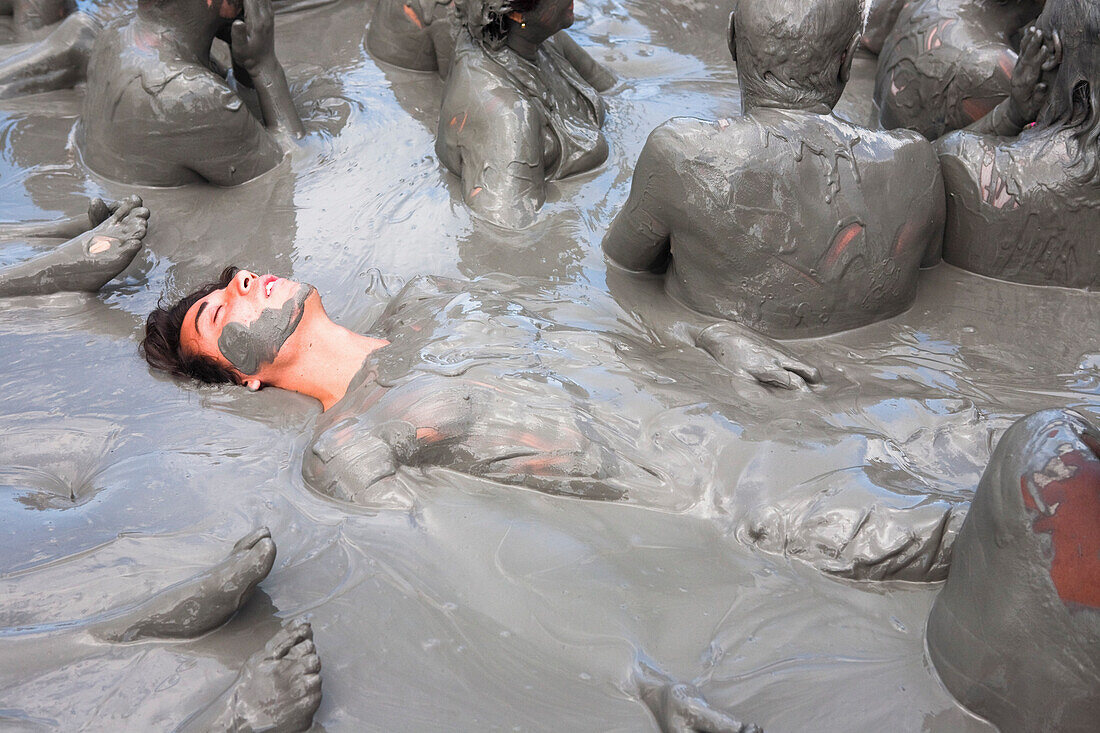 Tourists Getting Skin Enhancing Treatment At El Totumo Mud Volcano, Catagena, Colombia
