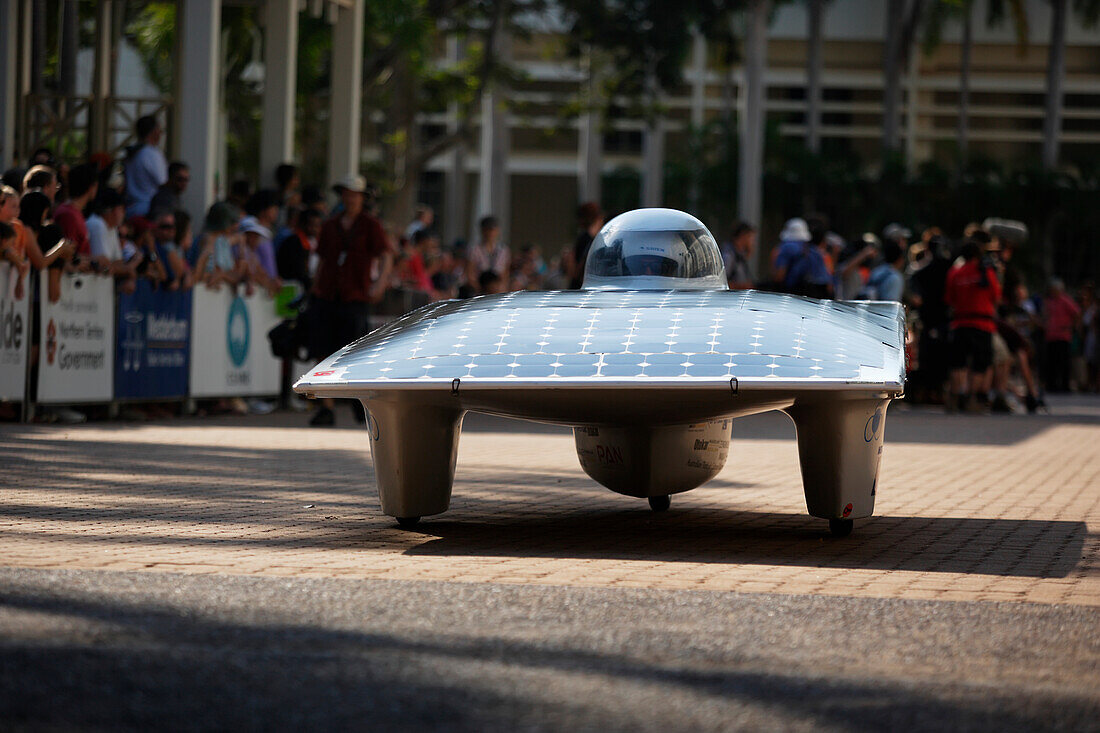 'Solar car departing on the road; Darwin, Australia'