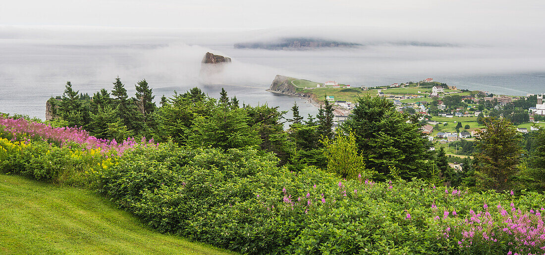 'View of Perce Rock through the fog from Mont-Sainte-Anne; Perce, Quebec, Canada'