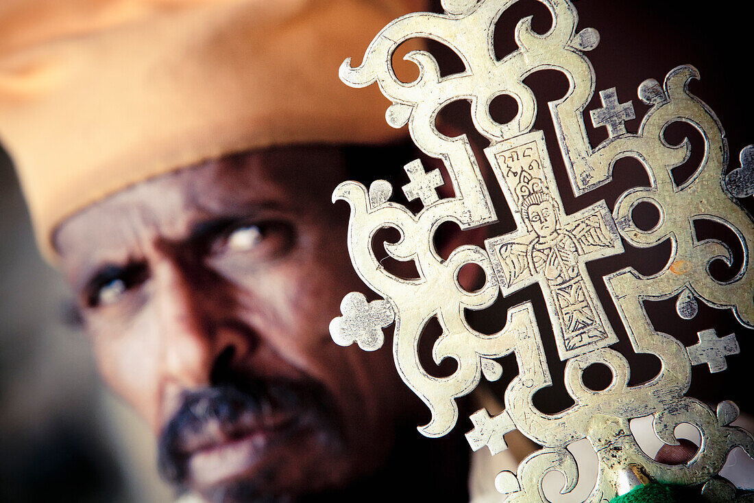 'Orthodox priest with ceremonial cross; Ethiopia'