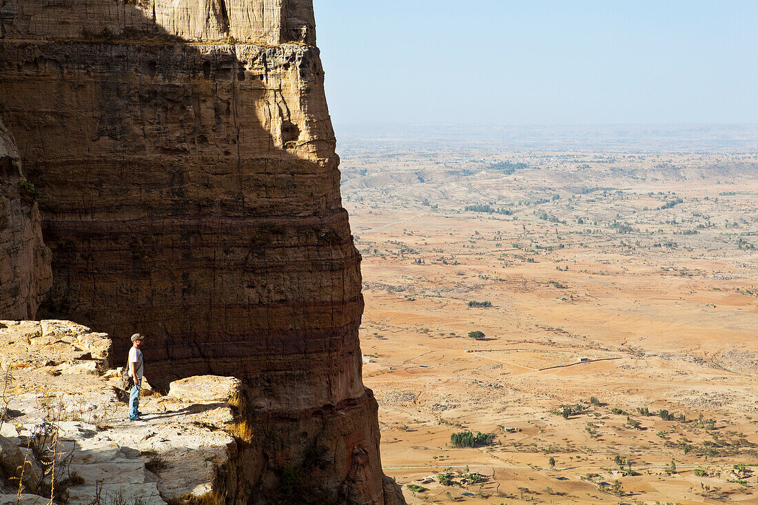 'Tourist trekking in the amazing mountain scenery on the Gheralta plateau; Tigray region, Ethiopia'