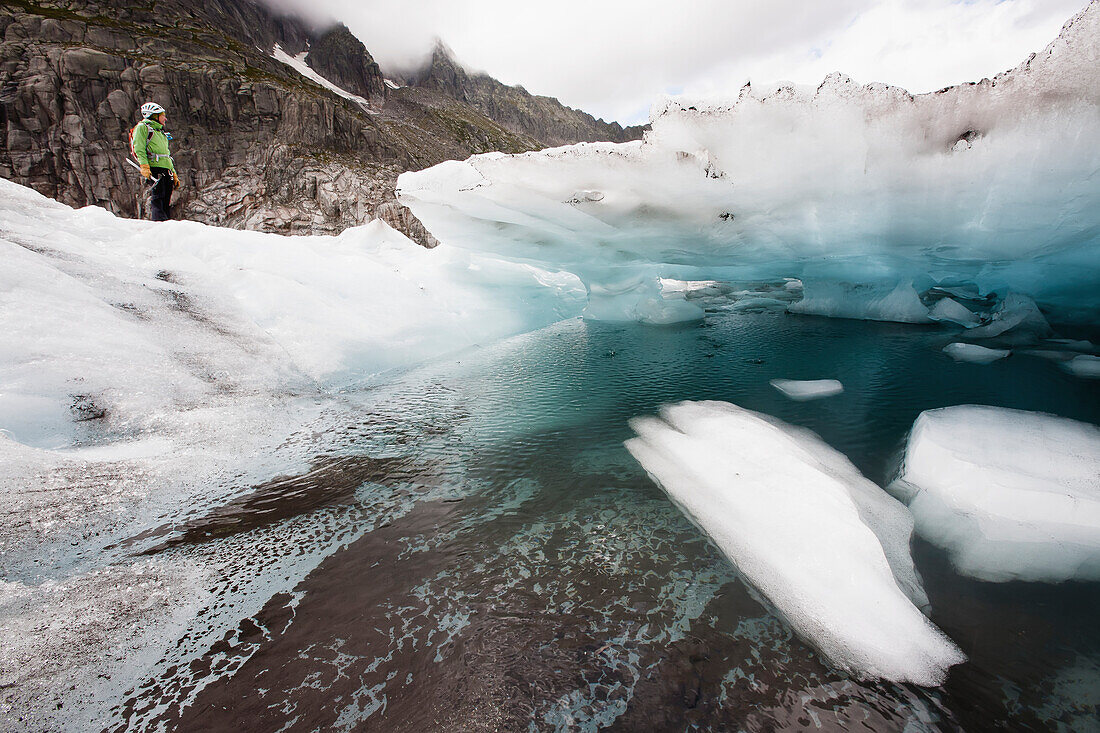 'A guide on Mer de Glace (Sea of Ice) glacier using crampon and ice-axe techniques prior to attempt on climbing Mont Blanc; France'