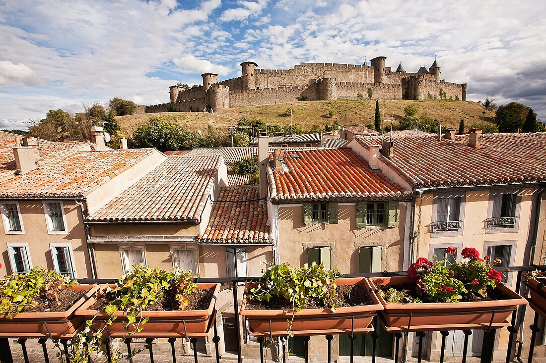 'Castle and ramparts viewed from the balcony of a bed and breakfast accommodation; Carcassonne, Languedoc-Rousillion, France'