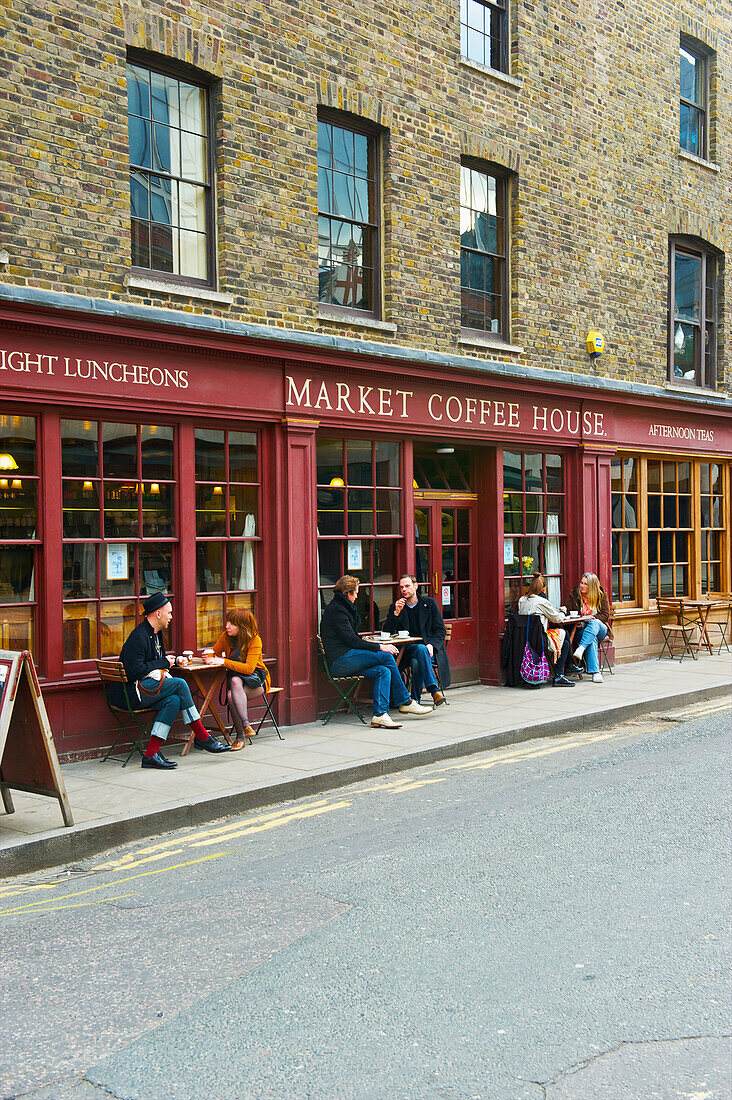 'Customers sit at tables outside Market Coffee House, Spitalfields; London, England'
