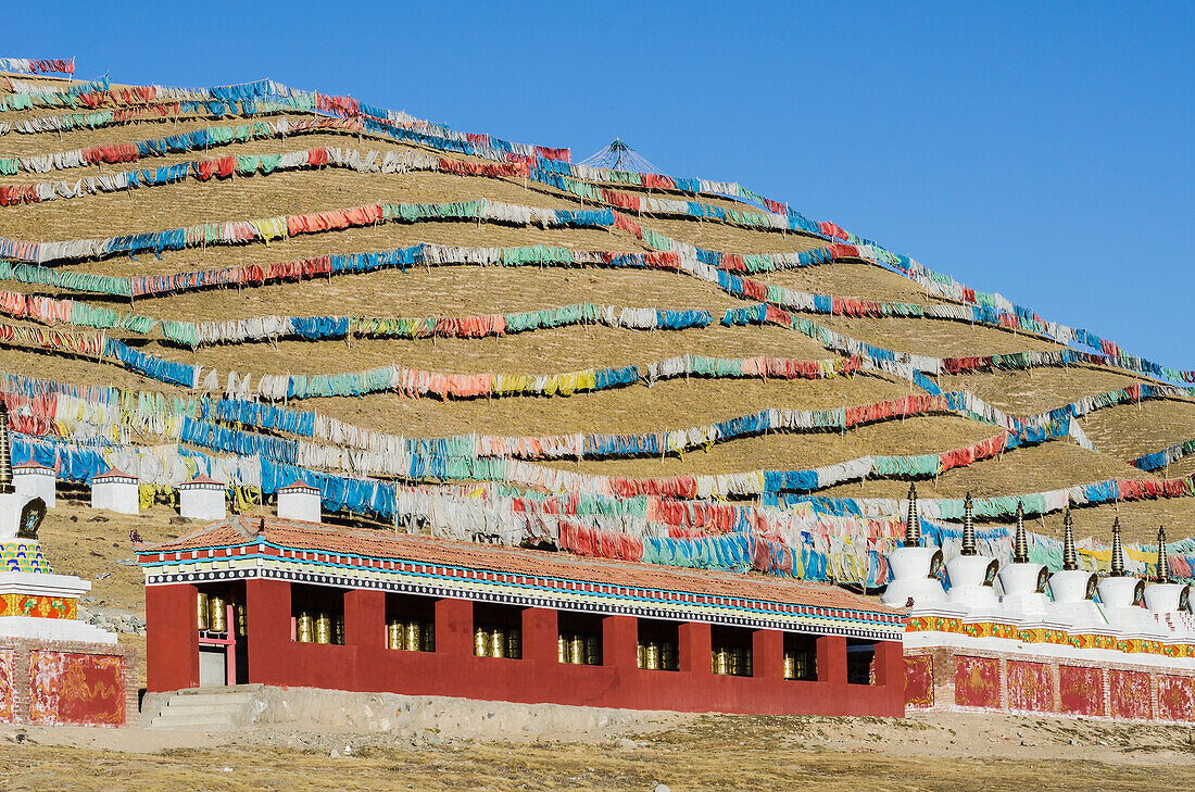 'Abundance of prayer flags on a mountain slope at a Tibetan monastery near Hot Spring city; Madoi County, Tibet'
