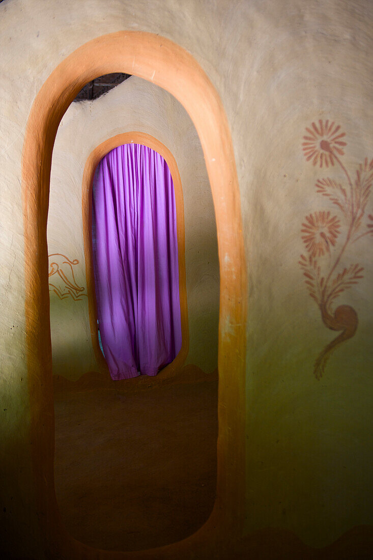 'A purple curtain over a doorway; Ulpotha, Embogama, Sri Lanka'