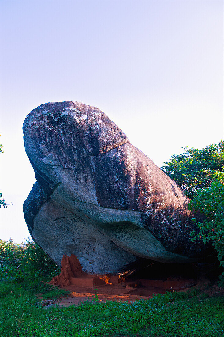 'A large boulder against a blue sky; Ulpotha, Embogama, Sri Lanka'
