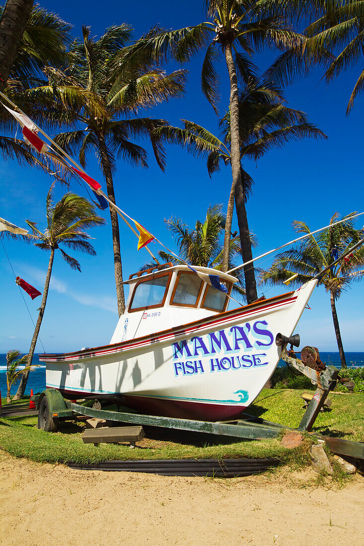Hawaii, Maui, A fishing boat in front of Mama's Fish House restaurant on the north shore. EDITORIAL USE ONLY.
