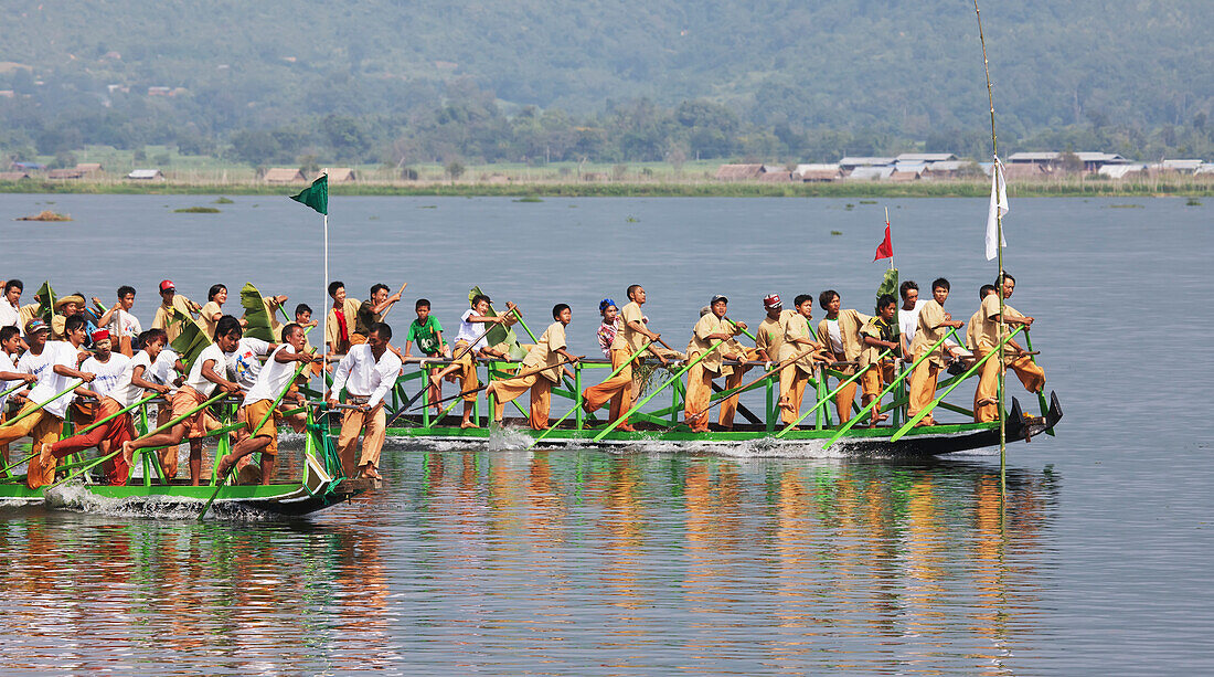 'Leg rowing procession on Inle Lake; Myanmar'