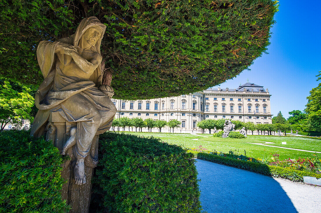 Statue under a tree in the Baroque gardens in the Wurzburg Residence, UNESCO World Heritage Site, Wurzburg, Franconia, Bavaria, Germany, Europe