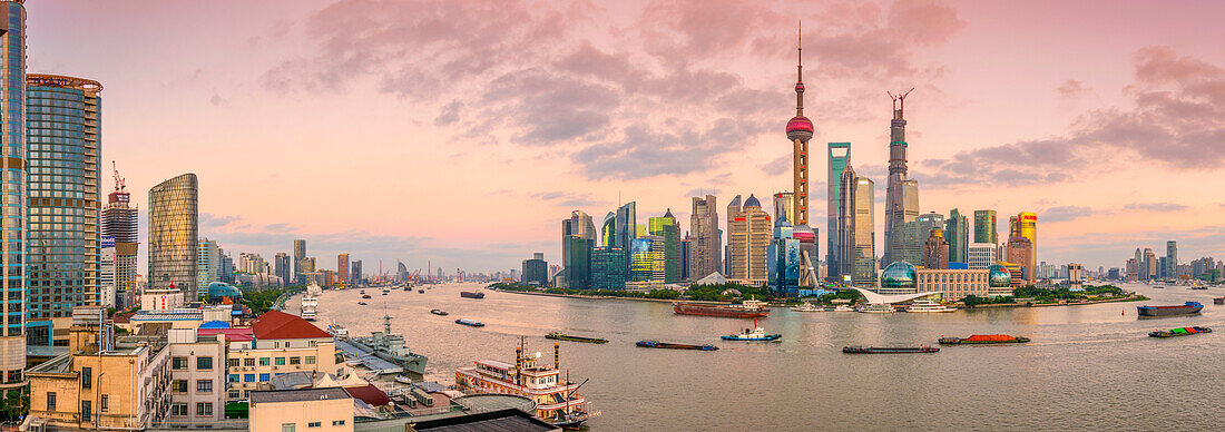 Pudong skyline across Huangpu River, including Oriental Pearl Tower, Shanghai World Financial Center and Shanghai Tower, Shanghai, China, Asia