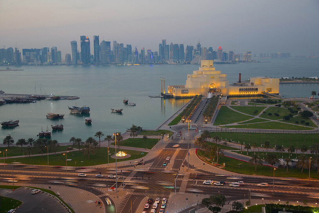 Museum of Islamic Art and West Bay Central Financial District from East Bay District at dusk, Doha, Qatar, Middle East