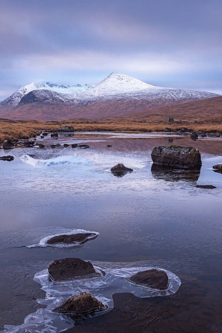 Frozen lochan reflecting the Black Mount in winter, Rannoch Moor, Scotland, United Kingdom, Europe