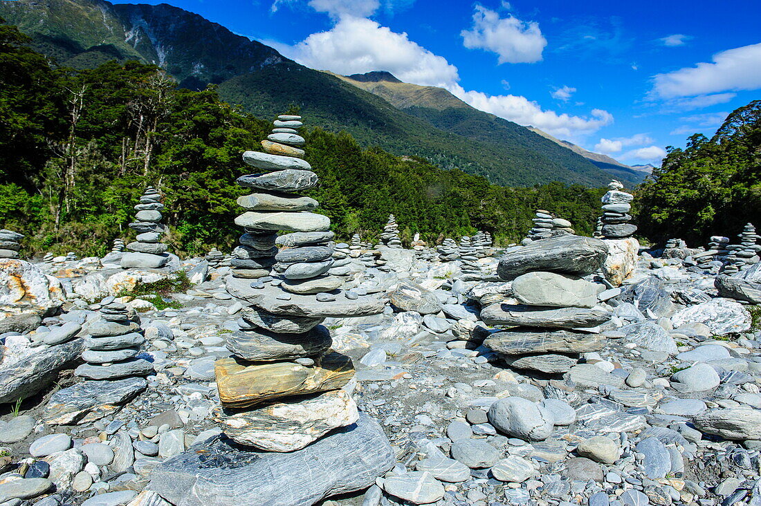 Man made stone pyramids at the Blue Pools, Haast Pass, South Island, New Zealand, Pacific