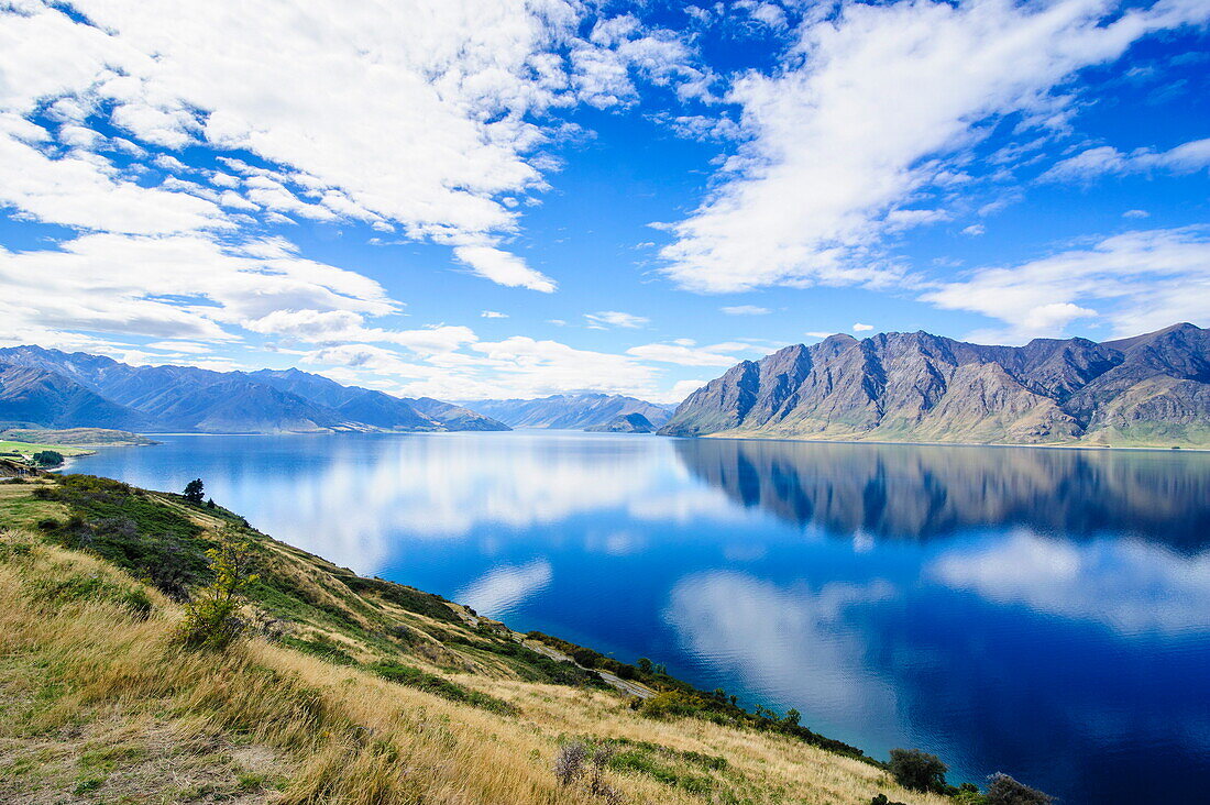Cloud reflections in Lake Hawea, Haast Pass, South Island, New Zealand, Pacific