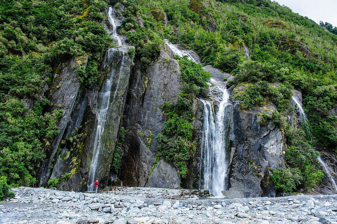 Huge waterfall on the bottom of Franz-Joseph Glacier, Westland Tai Poutini National Park, Southern Alps, UNESCO World Heritage Site, South Island, New Zealand, Pacific