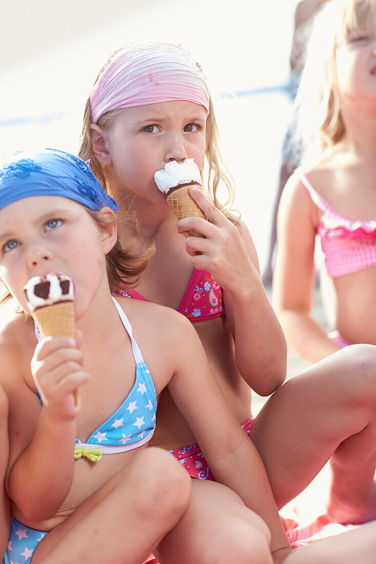 Three girls eating ice cream, lake Starnberg, Upper Bavaria, Bavaria, Germany