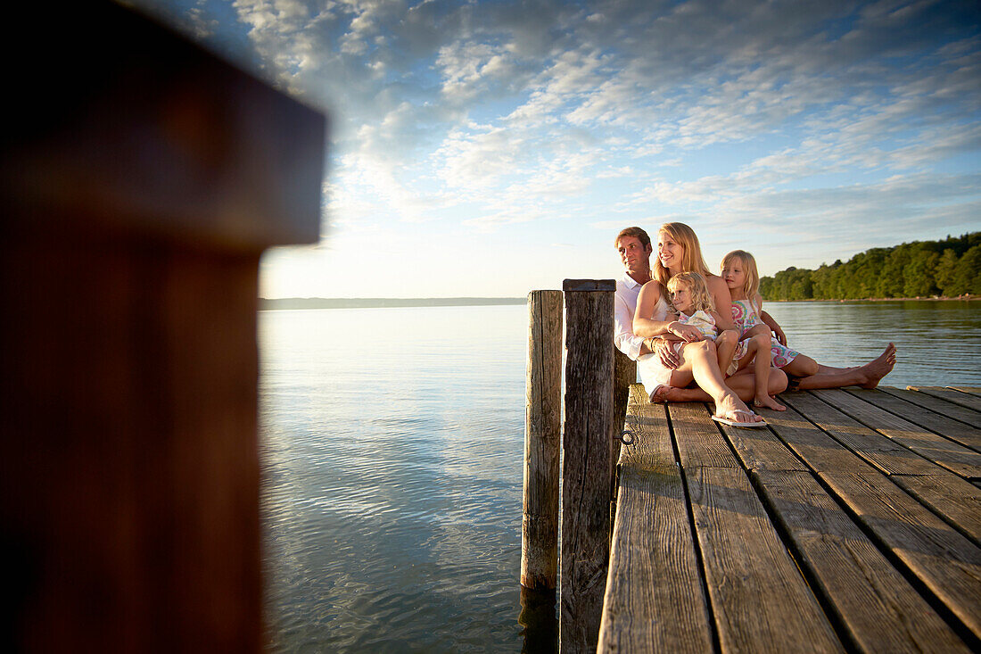 Family on a jetty at lake Starnberg, Upper Bavaria, Bavaria, Germany