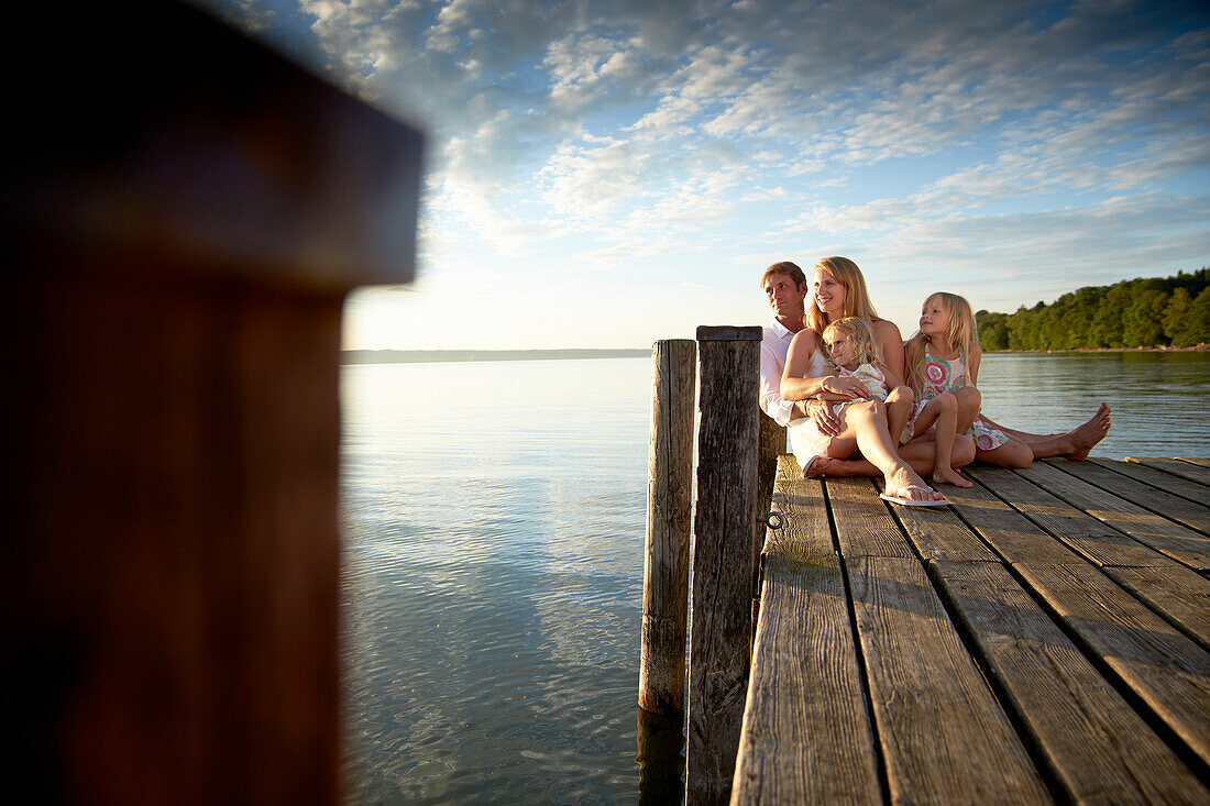 Family on a jetty at lake Starnberg, Upper Bavaria, Bavaria, Germany