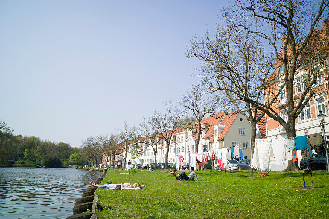 Lawn along the river Trave, Lubeck, Schleswig-Holstein, Germany