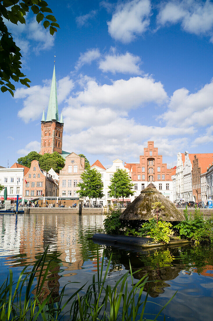 View over river Trave to historic city with church of St. Peter, Lubeck, Schleswig-Holstein, Germany