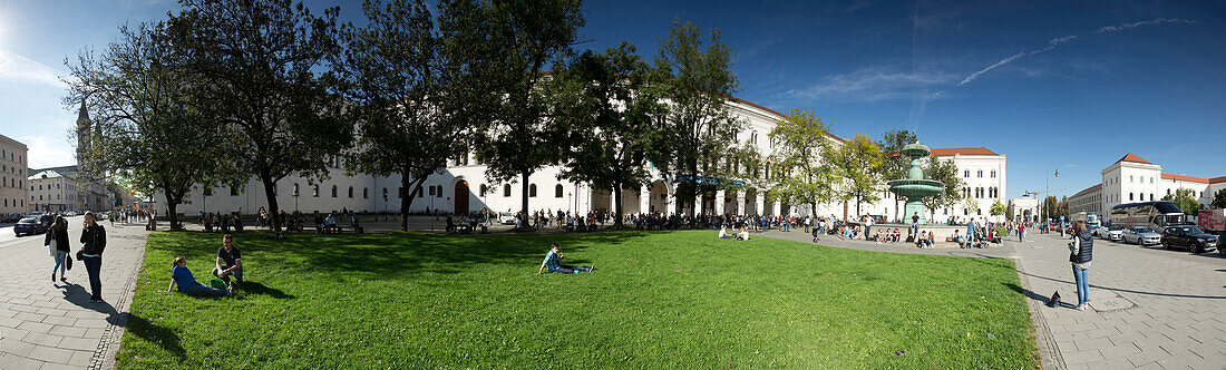 Students at Geschwister-Scholl-Platz (Siblings Scholl Plaza), Ludwig Maximilian University, Munich, Bavaria, Germany