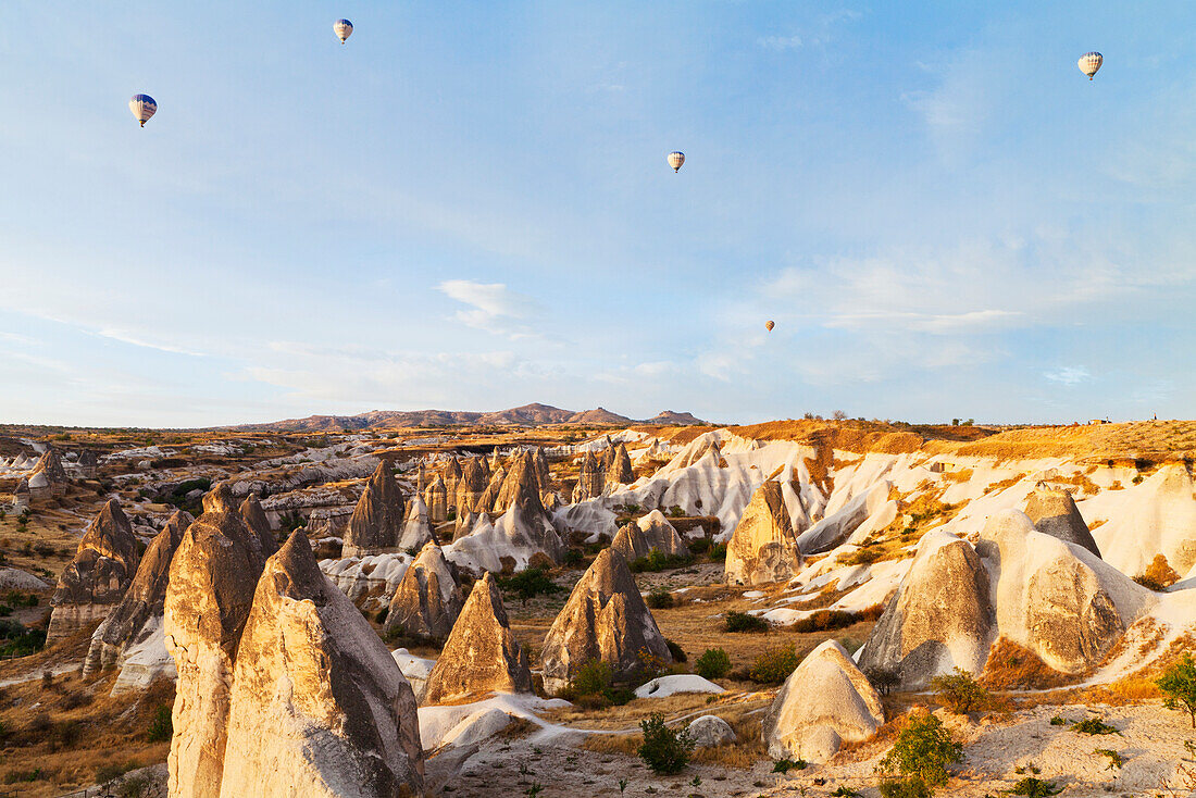 'Hot air balloons in the sky above the fairy chimneys; Goreme, Cappadocia, Turkey'